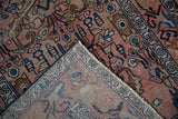 Worn distressed pile and visible woven foundation of a vintage Hamadan runner.