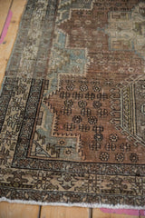 Distressed Vintage Karaja rug pile, highlighting worn texture with muted ivory, copper, and blue patterns.