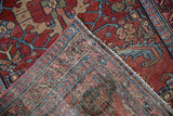 Mehreban rug runner's woven foundation and knot heads, with red, blue geometric pile.