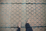 Worn pile texture of distressed Malayer rug, revealing faint foundation and abrash.