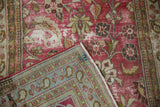 Distressed vintage Doroksh rug corner, worn magenta pile, showing pale blue pawn motif reverse.