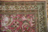 Distressed vintage Doroksh rug corner, with pale blue paisley and pawn borders.