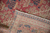 Distressed pile of vintage Joshegan rug and tightly woven hand-knotted back