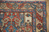 Lighter-toned sand border on a vintage Karaja rug with serrated double palmette motifs.