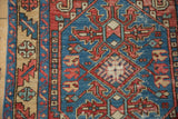 Mostly even wear showing the hand-knotted texture of serrated patterns on a vintage Karaja rug.