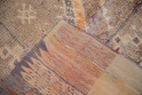 Distressed Moroccan rug runner pile and tightly woven foundation with side selvage.