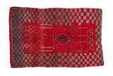 Vintage Moroccan rug in cherry red and turquoise with a bold checkerboard and geometric pattern.