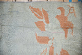 Hand-knotted back of a Moroccan rug showing a textured weave in blue and coral.