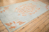 Angled view of a Moroccan runner, highlighting the textured pile and terracotta medallion.