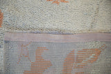 Back of the vintage Moroccan rug, revealing the tight, hand-knotted foundation and secured fabric edge.