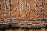 Shaggy wool pile, plain weave foundation, and fringe of a vintage Moroccan rug.