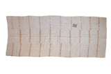 Distressed hemp kilim runner with banded stripes in neutral tones and a single characterful patch.