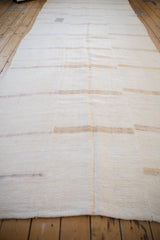 The multi-panel assembly and full length of a vintage distressed hemp kilim runner.