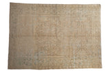 Vintage distressed Mehrivan carpet with a geometric floral field in cream, ivory, and dusty sea foam green.