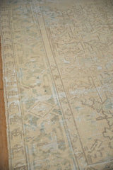 Low pile texture and time-softened geometric pattern on a distressed vintage Mehrivan rug.