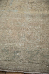 Mostly even wear across the knot heads of the vintage distressed Mehrivan carpet's pile.
