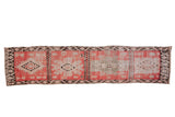 Vintage Moroccan runner rug with four medallion panels in blush pink, charcoal, and silver tones.