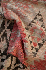 Hand-knotted low pile texture of a vintage Moroccan runner in blush and charcoal.