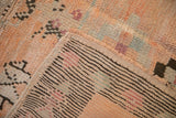 The hand-knotted foundation of the Moroccan rug, showing the tight weave and original secured side selvage.