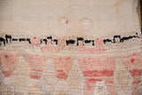 Distressed texture of vintage Moroccan runner, ivory flatweave to raised pink and black pile.