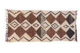 Moroccan runner with geometric diamond pattern in ivory, natural brown, charcoal. 2'9