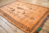 Vintage Moroccan rug, close-up of chocolate brown checkered border and side selvage.