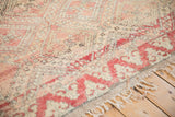 Plush vintage Moroccan rug pile with trellis vines, floral motifs, and abrashes in blush and beige.