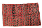 Vintage Moroccan carpet with a mountain triangle design in pale red, charcoal, and silver with heavy abrash.