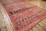 Angled view showing the mostly even pile and soft texture of a hand-knotted Moroccan carpet.