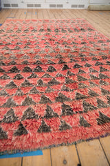 Heavy, shaggy pile and mountain-inspired triangle design of a vintage Moroccan rug.