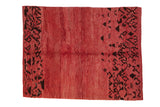 Vintage Moroccan carpet with a raspberry red open field and abstract dark chocolate brown side patterns.