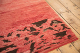 The even hand-knotted pile and secured selvage of a vintage Moroccan rug corner.