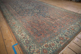 Distressed vintage Bibikabad carpet with blush Herati pattern and intricate ivory border.