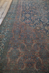 Detailed Herati motif on a vintage Bibikabad carpet, featuring time-softened dusty navy and blush tones.