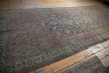 Vintage distressed Bibikabad rug with even wear, intricate Herati pattern and border.