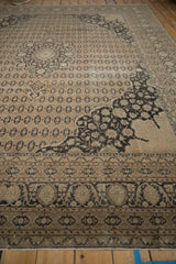 Textural charcoal arabesque and pale coffee cartouche patterns on vintage distressed Sivas carpet.