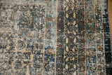 Distressed vintage Bibikabad carpet close-up, revealing intricate Herati patterns and varied pile.