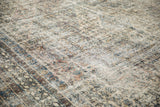 Worn, textured surface of a vintage Bibikabad rug showing ivory, sand, and blue tones.