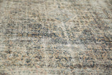 Textured detail of the distressed vintage Bibikabad carpet, showing low pile and faded colors.