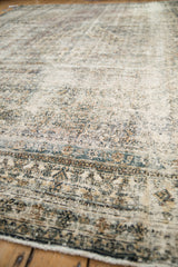 Textural low pile on a distressed Bibikabad rug, revealing Herati motifs and crab border.