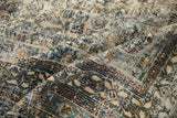 Distressed vintage Bibikabad rug texture with visible knot heads in faded navy and sand.