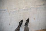 Vintage Turkish hemp Kilim rug's textured surface and visible central seam.