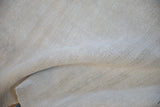Hemp foundation texture and central seam of the vintage Turkish Kilim rug.