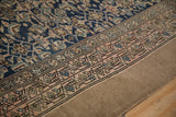 Antique distressed Northwest Persian runner border, pale fuchsia vines, cobalt Herati field, and worn pile.