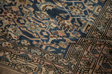 Textured pile showing geometric Herati motif in cobalt blue, pale fuchsia, and camel.