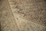 Antique Hamadan rug's textured Herati pattern, zig-zag field, and Samovar border in soft brown and ivory.