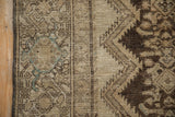 Distressed Hamadan side edge, worn pile showing foundation, chocolate brown, ivory, blue.