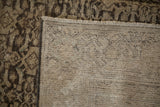 Distressed antique Hamadan carpet's hand-knotted foundation, showing texture and small reweaves.