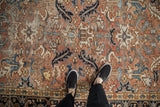 Hand knotted vintage Mehrivan rug pile with faded blush, navy, and ivory floral patterns.