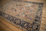 Classic reciprocating turtle Samovar and Herati motifs in the navy main border of the Mehrivan rug.